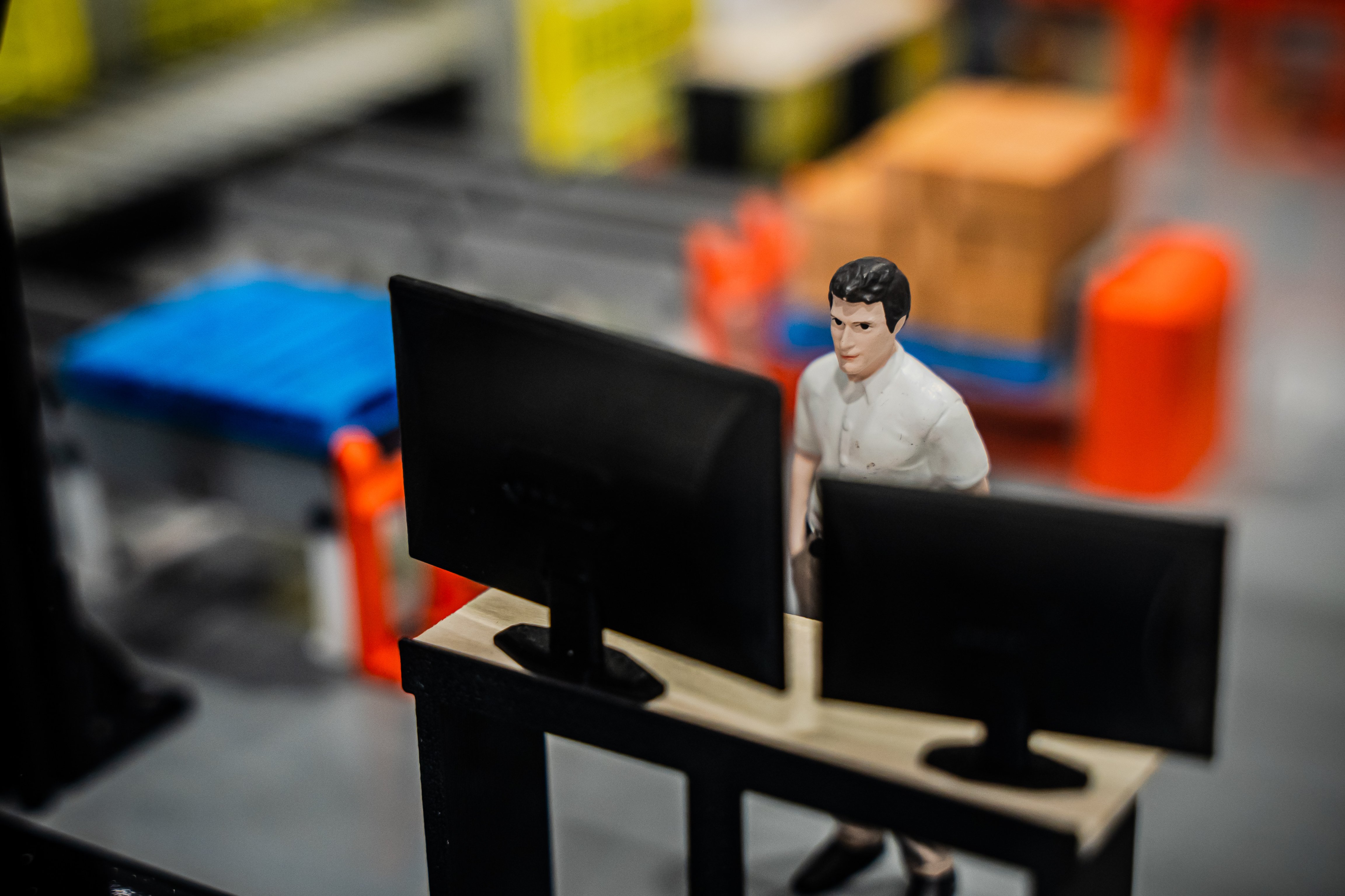 3D model guy looking at multiple screens-1
